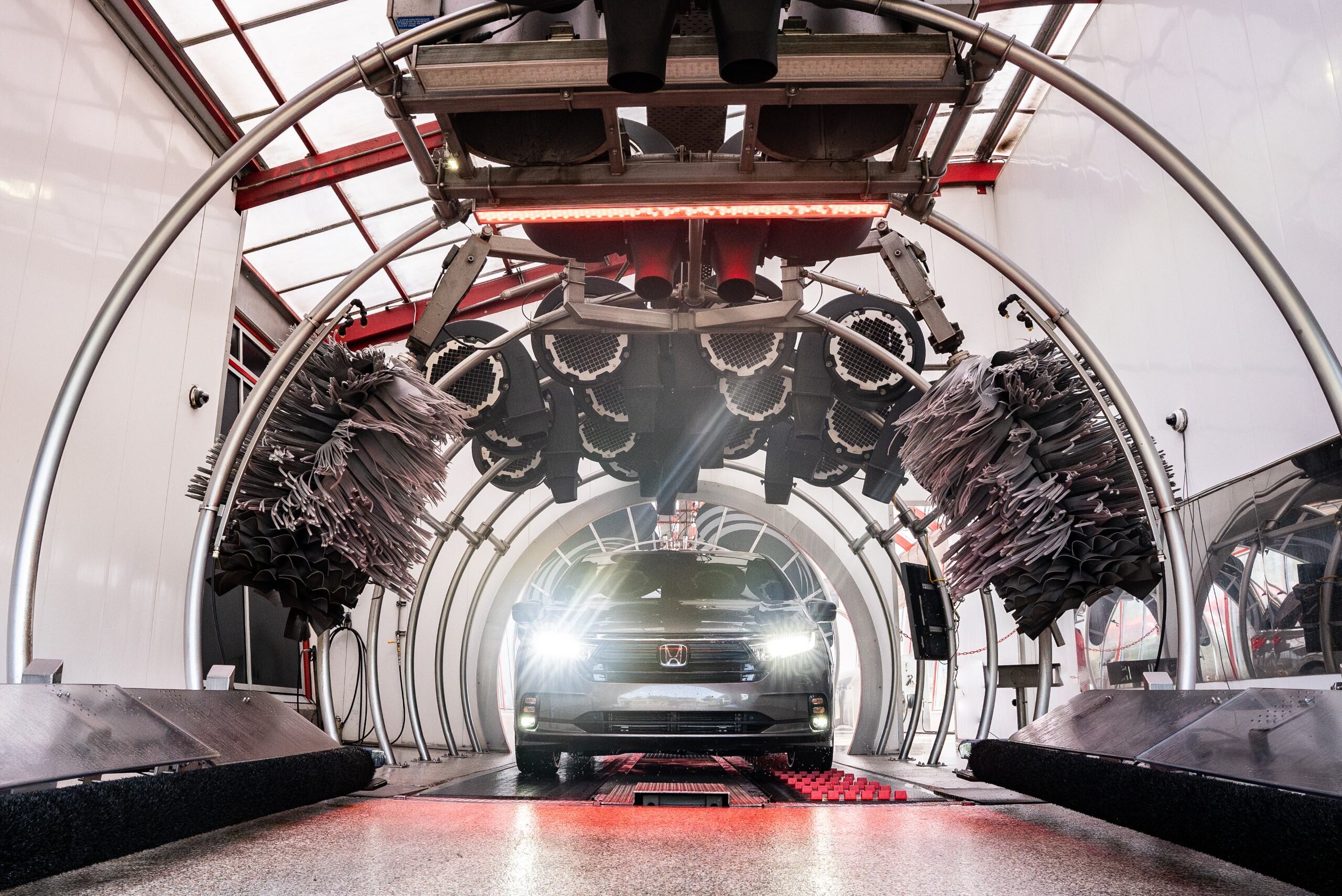 Car going through car wash drying tunnel